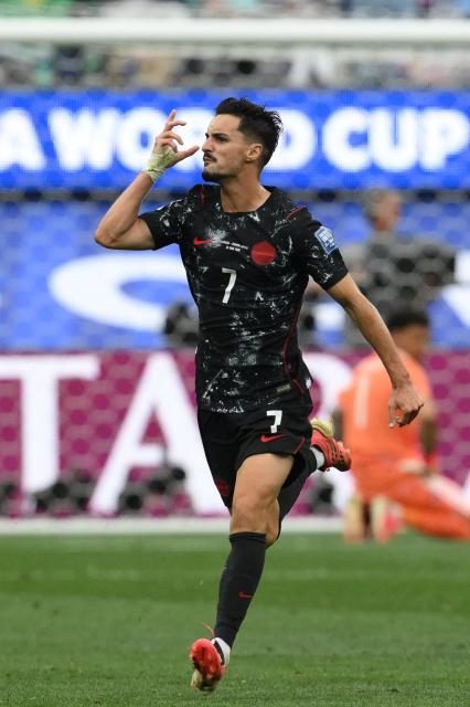 Canada's midfielder #07 Stephen Eustaquio celebrates scoring his team's first goal during the 2026 World Cup round of 32 football match between South Africa and Canada at the Los Angeles Stadium in Inglewood on June 28, 2026.  (Photo by Patrick T. Fallon / AFP)