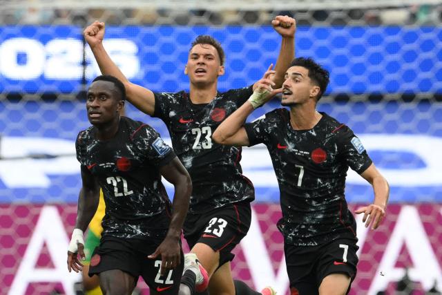 TOPSHOT - Canada's midfielder #07 Stephen Eustaquio celebrates scoring his team's first goal during the 2026 World Cup round of 32 football match between South Africa and Canada at the Los Angeles Stadium in Inglewood on June 28, 2026.  (Photo by Patrick T. Fallon / AFP)