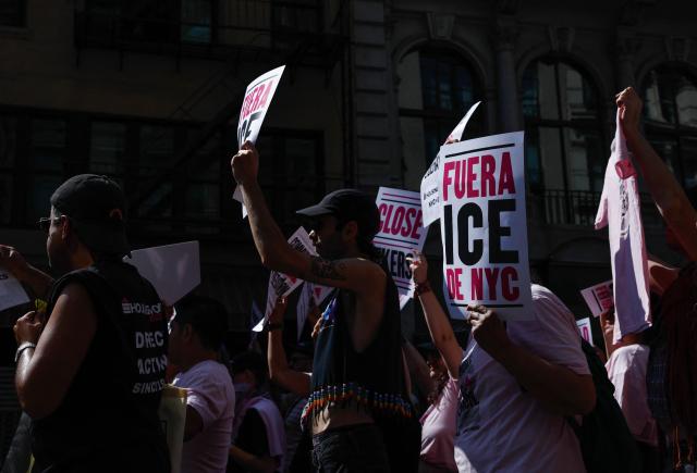 People hold anti-ICE signs as they participate in the Queer Liberation March in New York on June 28, 2026. (Photo by kena betancur / AFP)