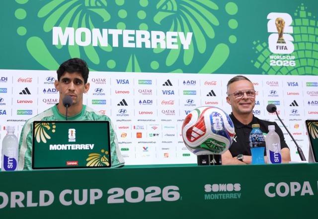 Morocco's goalkeeper #01 Yassine Bounou and Morocco's head coach Mohamed Ouahbi attend a press conference on the eve of the 2026 World Cup Round of 32 football match between Morocco and the Netherlands at Monterrey stadium in Monterrey, Mexico on June 28, 2026.  (Photo by Julio Cesar AGUILAR / AFP)