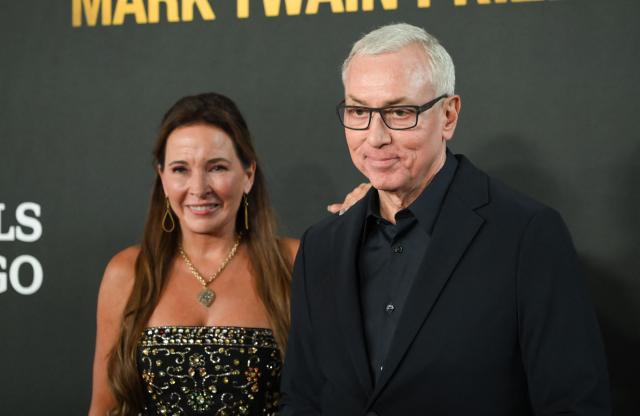 US media personality Drew Pinsky and his wife producer Drew Pinsky arrive for the 27th Mark Twain Prize for American Humor Gala at the Kennedy Center in Washington, DC, on June 28, 2026. (Photo by Alex WROBLEWSKI / AFP)