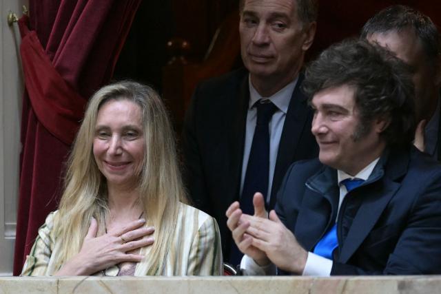 (FILES) Argentina’s President Javier Milei (R) applauds as Argentina’s Secretary General of the Presidency Karina Milei gestures next to Interior Minister Diego Santilli (C-back), during the oath ceremony at the Chamber of Deputies of the Argentinian Congress on December 3, 2025. Argentina's President Javier Milei on June 28, 2026 appointed Diego Santilli, who had been serving as Interior Minister, as the new Chief of Staff, replacing Manuel Adorni, who resigned on the eve amid a judicial investigation for alleged illicit enrichment. (Photo by JUAN MABROMATA / AFP)