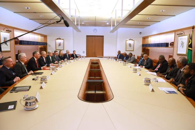 Vanuatu's Prime Minister Jotham Napat (centre R) and his cabinet members attend a meeting with Australian Prime Minister Anthony Albanese (centre L) and cabinet members at Parliament House in Canberra on June 29, 2026. (Photo by DAVID GRAY / AFP)