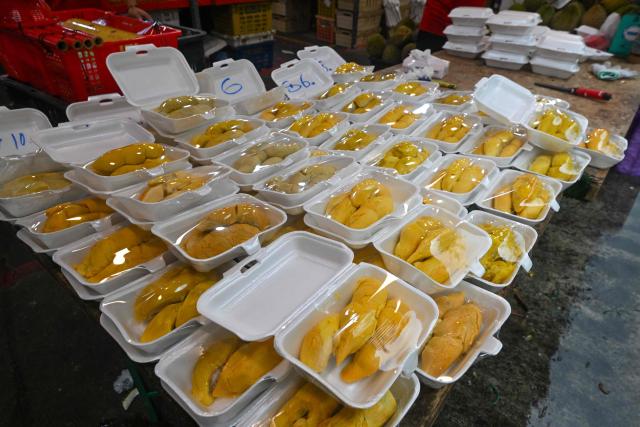 Durians are displayed for sale at a market in Singapore on June 24, 2026. (Photo by Roslan RAHMAN / AFP)