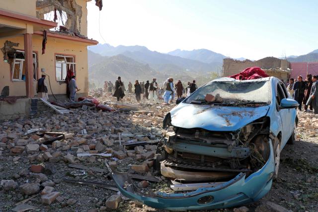 TOPSHOT - Afghan residents look at the remains of a building damaged in a Pakistani airstrike at a village in Afghanistan's Paktia province on June 29, 2026. Pakistan carried out airstrikes overnight in eastern Afghanistan, Islamabad said on June 29, adding its operations had targeted militants as the Afghan government reported dozens of civilian casualties. (Photo by AFP)
