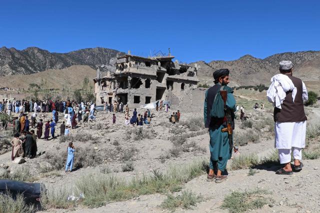 Afghan residents and a Taliban security personnel gather at the site of a Pakistani airstrike at a village in Tsamkani district of Afghanistan's Paktia province on June 29, 2026. Pakistan carried out airstrikes overnight in eastern Afghanistan, Islamabad said on June 29, adding its operations had targeted militants as the Afghan government reported dozens of civilian casualties. (Photo by AFP)