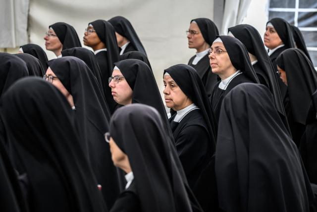 Nuns attend an ordination ceremony of the traditionalist Catholic Society of Saint Pius X (SSPX), in Econe, near Sion, western Switzerland, on June 29, 2026. Defying Vatican, Society of Saint Pius X will ordain its own bishops on July 1, 2026, despite the risk of being considered schismatic. (Photo by Fabrice COFFRINI / AFP)