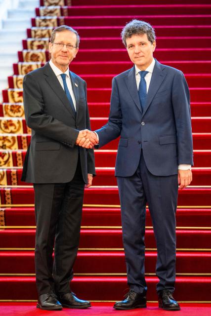 Israeli President Isaac Herzog (L) and Romanian President Nicusor Dan shake hands as they pose for an official photo at the presidential Cotroceni Palace in Bucharest, Romania, on June 29, 2026. (Photo by Mihai Barbu / AFP)