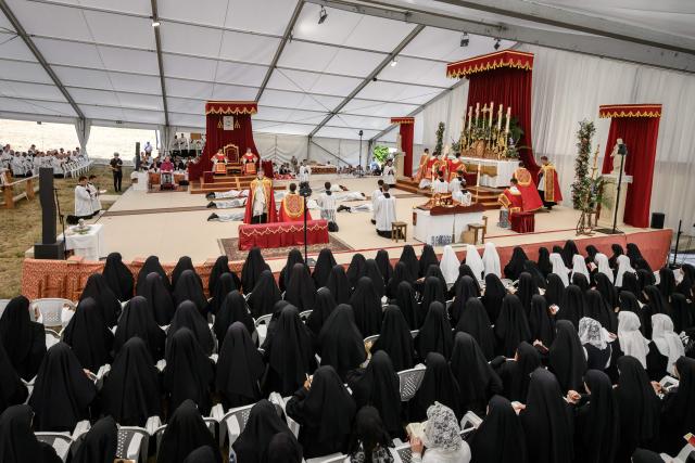 Priests and deacons prostrate themselves during an ordination ceremony of the traditionalist Catholic Society of Saint Pius X (SSPX), in Econe, near Sion, western Switzerland, on June 29, 2026. Defying Vatican, Society of Saint Pius X will ordain its own bishops on July 1, 2026, despite the risk of being considered schismatic. (Photo by Fabrice COFFRINI / AFP)