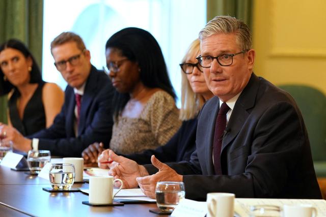 Britain's Prime Minister Keir Starmer (R) speaks as he hosts a roundtable with the hospitality industry at 10 Downing Street in central London on June 29, 2026. (Photo by Alberto Pezzali / POOL / AFP)