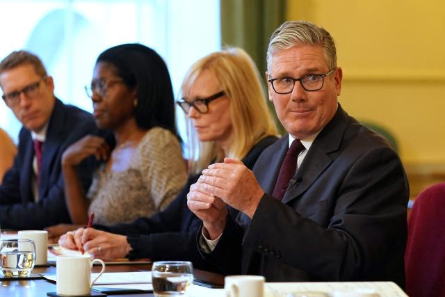 Britain's Prime Minister Keir Starmer (R) speaks as he hosts a roundtable with the hospitality industry at 10 Downing Street in central London on June 29, 2026. (Photo by Alberto Pezzali / POOL / AFP)