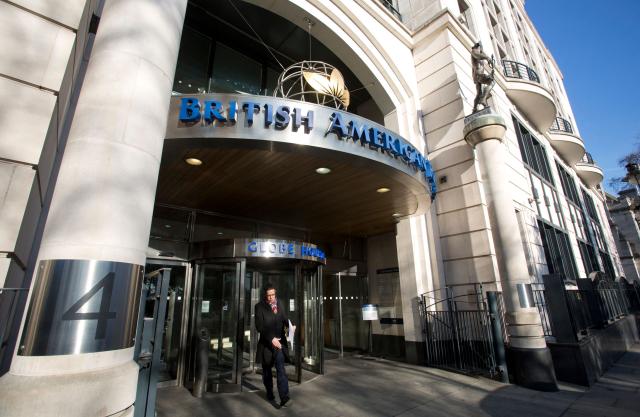 (FILES) Signage is pictured on the front of the headquarters quarters of British American Tobacco at Temple Place in central London on January 17, 2017. British American Tobacco announced on June 29, 2026 sweeping job cuts as the cigarette maker axes 5,500 roles globally and outsources another 3,500 to help slash costs. (Photo by Isabel Infantes / AFP)