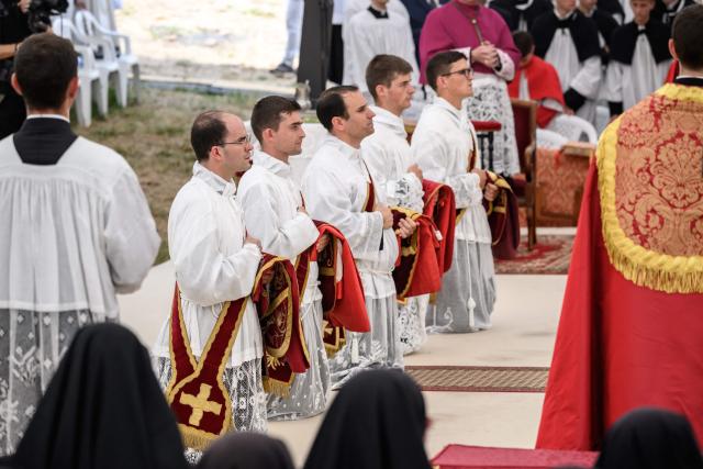 New priests takes part in an ordination ceremony of the traditionalist Catholic Society of Saint Pius X (SSPX), in Econe, near Sion, western Switzerland, on June 29, 2026. Defying Vatican, Society of Saint Pius X will ordain its own bishops on July 1, 2026, despite the risk of being considered schismatic. (Photo by Fabrice COFFRINI / AFP)