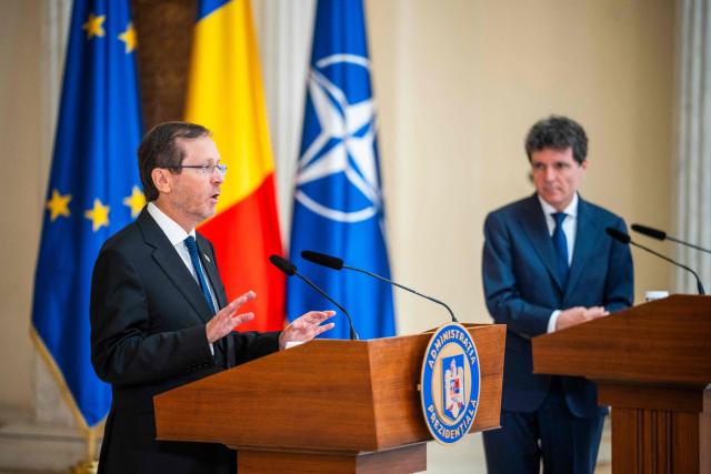 Israeli President Isaac Herzog (L) speaks during a press conference with Romanian President Nicusor Dan at the Cotroceni Presidential Palace, in Bucharest, Romania, on June 29, 2026. (Photo by Mihai Barbu / AFP)