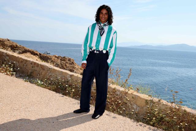 French model Tina Kunakey's brother Zakari Kunakey pose for a photocall upon arrival to attend the Jacquemus "Le Bohneur" collection fashion show in L'Ile-Rousse on the French Mediterranean island of Corsica on June 29, 2026. (Photo by Pascal POCHARD-CASABIANCA / AFP)