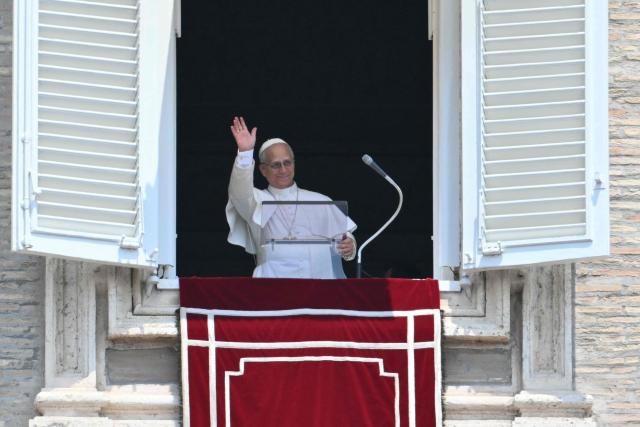 Pope Leo XIV waves to the crowd from the window of the apostolic palace overlooking St. Peter's square during an Angelus prayer on the Solemnity of Saints Peter and Paul, Rome's patron saints in The Vatican on June 29, 2026. (Photo by Alberto PIZZOLI / AFP)