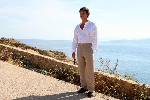Australian actor Sam Corlett poses for a photocall upon arrival to attend the Jacquemus "Le Bohneur" collection fashion show in L'Ile-Rousse on the French Mediterranean island of Corsica on June 29, 2026. (Photo by Pascal POCHARD-CASABIANCA / AFP)