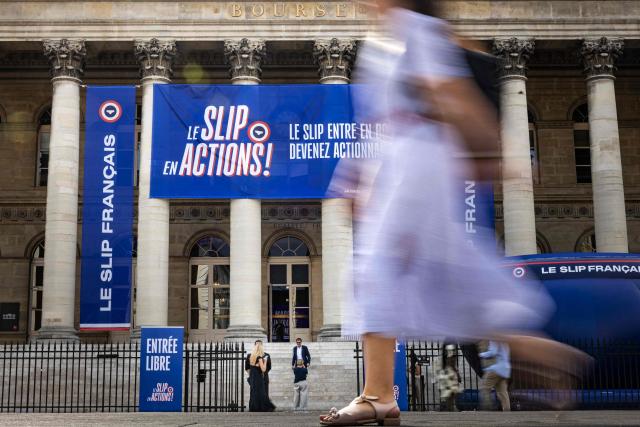 This photograph shows banners hanging on the Palais Brongniart to announce the IPO of the company "Le Slip Français" on June 29, 2026. The underwear brand Le Slip français, one of the leaders of the "made in France" movement, announced on June 25, 2026 that it will go public on the symbolic date of July 14, hoping to raise 5 million euros in fresh capital. (Photo by Joel Saget / AFP)