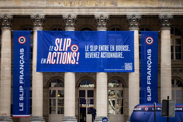 This photograph shows banners hanging on the Palais Brongniart to announce the IPO of the company "Le Slip Français" on June 29, 2026. The underwear brand Le Slip français, one of the leaders of the "made in France" movement, announced on June 25, 2026 that it will go public on the symbolic date of July 14, hoping to raise 5 million euros in fresh capital. (Photo by Joel Saget / AFP)