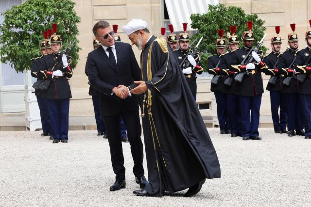 France's President Emmanuel Macron (L) welcomes Oman's Sultan Haitham bin Tarik ahead of a meeting at The Elysee Presidential Palace in Paris on June 29, 2026. (Photo by MEHDI FEDOUACH / AFP)