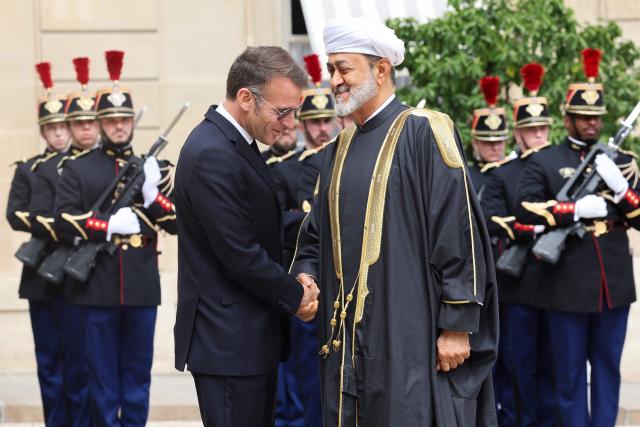 France's President Emmanuel Macron (L) welcomes Oman's Sultan Haitham bin Tarik ahead of a meeting at The Elysee Presidential Palace in Paris on June 29, 2026. (Photo by MEHDI FEDOUACH / AFP)