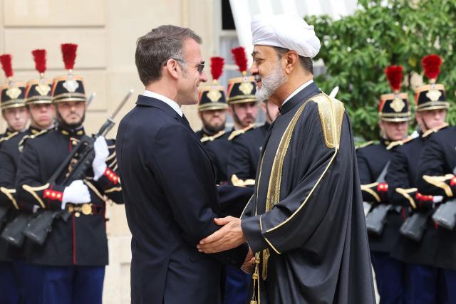 France's President Emmanuel Macron (L) welcomes Oman's Sultan Haitham bin Tarik ahead of a meeting at The Elysee Presidential Palace in Paris on June 29, 2026. (Photo by MEHDI FEDOUACH / AFP)