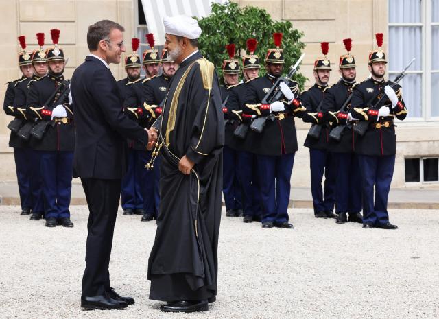 France's President Emmanuel Macron (L) welcomes Oman's Sultan Haitham bin Tarik ahead of a meeting at The Elysee Presidential Palace in Paris on June 29, 2026. (Photo by MEHDI FEDOUACH / AFP)