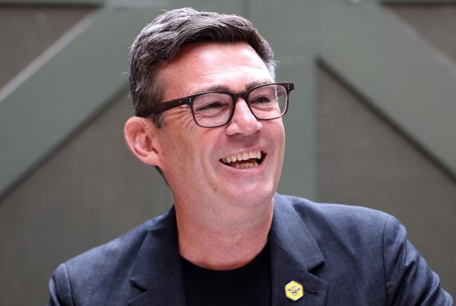 Labour MP and challenger for Leader of the Labour party, Andy Burnham, laughs as he delivers a speech in Manchester, northern England, on June 29, 2026. (Photo by Toby Shepheard / AFP)
