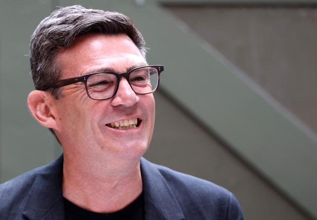 Labour MP and challenger for Leader of the Labour party, Andy Burnham, laughs as he delivers a speech in Manchester, northern England, on June 29, 2026. Burnham, the frontrunner to become Britain's next prime minister, set out his economic agenda on Monday, in his first major policy announcement since Keir Starmer resigned as premier last week. (Photo by Toby Shepheard / AFP)