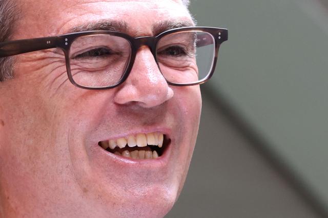 Labour MP and challenger for Leader of the Labour party, Andy Burnham, laughs as he delivers a speech in Manchester, northern England, on June 29, 2026. Burnham, the frontrunner to become Britain's next prime minister, set out his economic agenda on Monday, in his first major policy announcement since Keir Starmer resigned as premier last week. (Photo by Toby Shepheard / AFP)