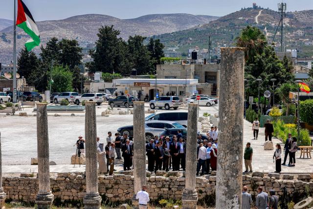 A group of foreign diplomats accredited by the Palestinian Authority visits the archaeological site of Sebastia, north of Nablus in the occupied West Bank, on June 29, 2026. (Photo by Jaafar ASHTIYEH / AFP)