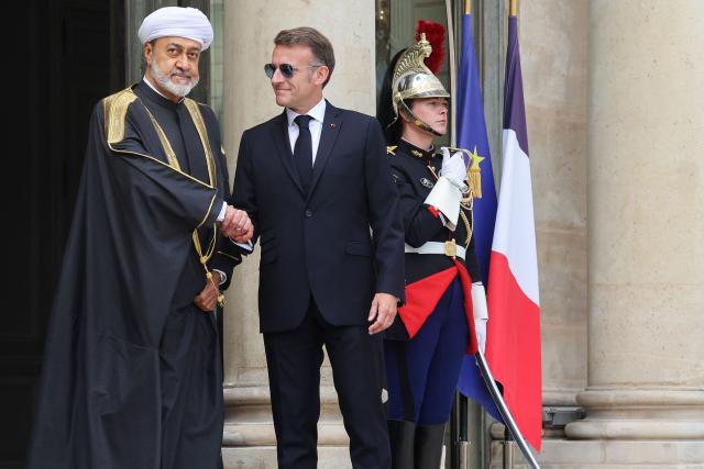France's President Emmanuel Macron (R) welcomes Oman's Sultan Haitham bin Tarik ahead of a meeting at The Elysee Presidential Palace in Paris on June 29, 2026. (Photo by MEHDI FEDOUACH / AFP)