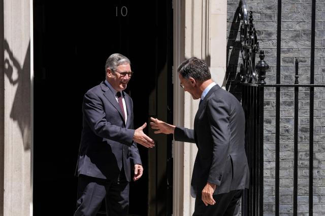 Britain's Prime Minister Keir Starmer (L) greets visiting NATO Secretary General Mark Rutte at 10 Downing Street before their meeting in central London on June 29, 2026. (Photo by CARLOS JASSO / AFP)