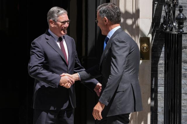 Britain's Prime Minister Keir Starmer (L) greets visiting NATO Secretary General Mark Rutte at 10 Downing Street before their meeting in central London on June 29, 2026. (Photo by CARLOS JASSO / AFP)