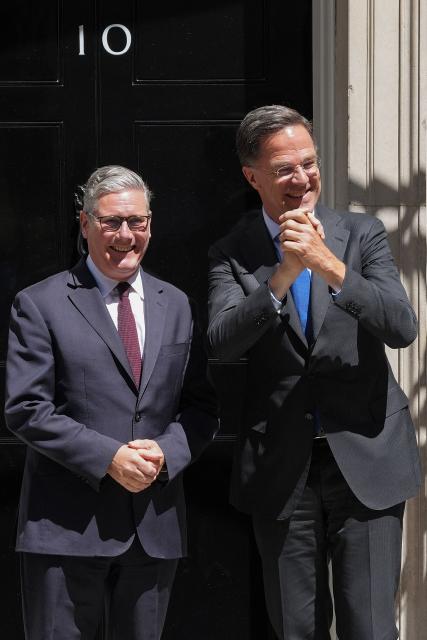 Britain's Prime Minister Keir Starmer (L) greets visiting NATO Secretary General Mark Rutte at 10 Downing Street before their meeting in central London on June 29, 2026. (Photo by CARLOS JASSO / AFP)