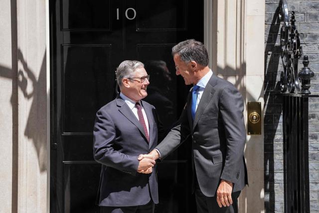Britain's Prime Minister Keir Starmer (L) greets visiting NATO Secretary General Mark Rutte at 10 Downing Street before their meeting in central London on June 29, 2026. (Photo by CARLOS JASSO / AFP)