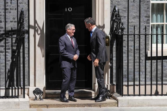Britain's Prime Minister Keir Starmer (L) greets visiting NATO Secretary General Mark Rutte at 10 Downing Street before their meeting in central London on June 29, 2026. (Photo by CARLOS JASSO / AFP)