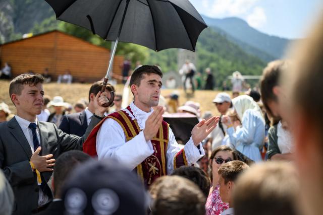 French traditionalist Catholic priest of the Society of Saint Pius X (SSPX) Benoit Braun blesses faithfuls after an ordination ceremony of the traditionalist Catholic Society of Saint Pius X (SSPX), in Econe, near Sion, western Switzerland, on June 29, 2026. Defying Vatican, Society of Saint Pius X will ordain its own bishops on July 1, 2026, despite the risk of being considered schismatic. (Photo by Fabrice COFFRINI / AFP)