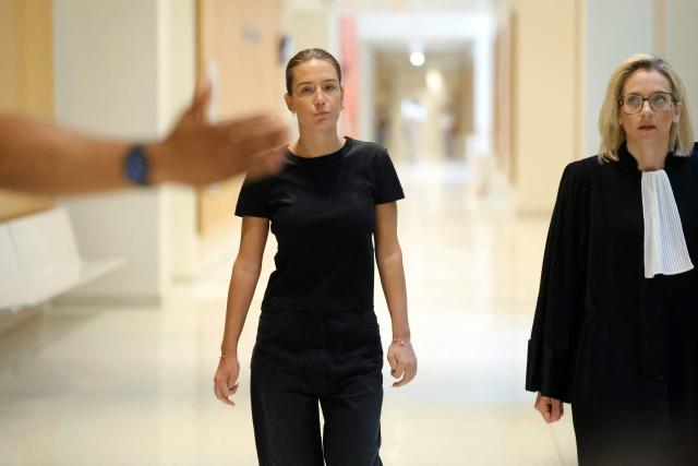 French actress Adele Exarchopoulos and her lawyer Marie Grimaud leave during a suspension of the hearing during the trial of her former partner, French rapper Doums (aka Mamadou Coulibaly) for domestic violence at the Paris Courthouse in Paris on June 29, 2026. (Photo by Thomas SAMSON / AFP)
