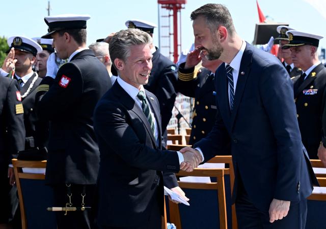 Poland's Deputy Prime Minister and Defence Minister Wladyslaw Kosiniak-Kamysz (R) shakes hands with Sweden's Defence Minister Pal Jonson during a meeting in Gdynia, Poland on June 29, 2026. Sweden's Prime Minister Ulf Kristersson and several of his ministers travelled to Gdynia, Poland for intergovernmental consultations. The focus will be on strengthened bilateral cooperation between Sweden and Poland, specifically with regard to regional security and defence. (Photo by Marcin Gadomski / AFP)