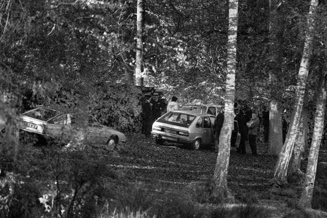(FILES) Policemen look for evidence near the small lake in Rambouillet forest, near Paris on October 30, 1979, where the body of 59-year-old French labour minister Robert Boulin, was discovered. Three investigating judges from the “cold cases” unit have been appointed to look into the unresolved 1979 death of former Labor Minister Robert Boulin, the presidency of the Nanterre judicial court announced on June 29, 2026. These judges “will now be able to resume the investigation of this case” and “carry out new inquiries without delay,” it added in a press release. (Photo by MICHEL CLEMENT / AFP)