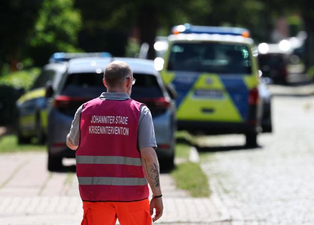 A member of a crisis intervention team stands at the scene where five people were killed in a shooting in Stade, northern Germany, a city some 50 kilometres west of Hamburg, on June 29, 2026. German police said five people were killed and others injured on June 29, 2026 in a shooting in a youth welfare facility in the northern city of Stade. Two people were arrested, including the suspected shooter, and there was now "no danger to the public", local police said in an update around 1215 GMT. (Photo by Ibrahim OT / AFP)