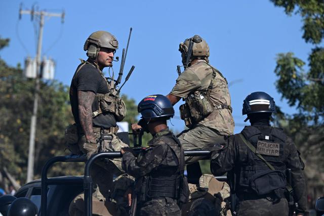 Us soldiers and Venezuelan military police patrol the streets of La Guaira, Venezuela on June 29, 2026, following twin earthquakes. Hopes were fading on June 29, 2026 of finding survivors more than four days after powerful twin earthquakes struck Venezuela, as residents grow increasingly frustrated with the government's response to the disaster that has killed at least 1,450 people and left tens of thousands unaccounted for. (Photo by Juan BARRETO / AFP)