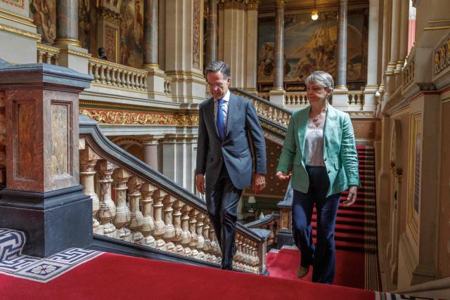 Britain's Foreign Secretary Yvette Cooper (R) and NATO Secretary General Mark Rutte (L) walk through the British Foreign and Commonwealth Office ahead of a meeting in central London on June 29, 2026. (Photo by Dan Kitwood / POOL / AFP)