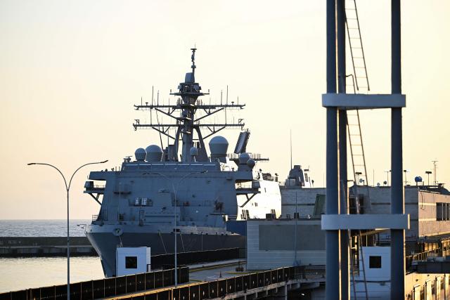 The USS Fort Lauderdale remains docked in the port of La Guaira, Venezuela, on June 29, 2026, following the June 24 twin earthquakes. Sailors and Marines from the USS Fort Lauderdale delivered supplies to the port of La Guaira on June 28 using a landing craft, SOUTHCOM said. A strong aftershock struck Caracas and La Guaira on June 29, AFP journalists reported, nearly five days after the double earthquake that has already claimed at least 1,450 lives. (Photo by Juan BARRETO / AFP)
