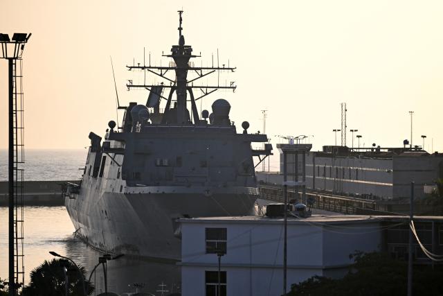 The USS Fort Lauderdale remains docked in the port of La Guaira, Venezuela, on June 29, 2026, following the June 24 twin earthquakes. Sailors and Marines from the USS Fort Lauderdale delivered supplies to the port of La Guaira on June 28 using a landing craft, SOUTHCOM said. A strong aftershock struck Caracas and La Guaira on June 29, AFP journalists reported, nearly five days after the double earthquake that has already claimed at least 1,450 lives. (Photo by Juan BARRETO / AFP)