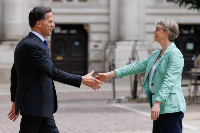 Britain's Foreign Secretary Yvette Cooper (R) and NATO Secretary General Mark Rutte (L) meet in the courtyard of the British Foreign and Commonwealth Office ahead of a meeting in central London on June 29, 2026. (Photo by Dan Kitwood / POOL / AFP)