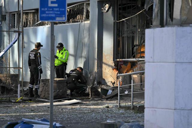 Police work outside the Ministry of Agriculture building, where a controlled explosion of a bomb was conducted, in Quito on June 29, 2026. Ecuadoran police conducted a controlled explosion of a bomb planted outside the Ministry of Agriculture shattering windows there. It was the second time in five days that a bomb has been found in the capital Quito, and comes as Ecuador grapples with rising violence by drug cartels. (Photo by Rodrigo BUENDIA / AFP)