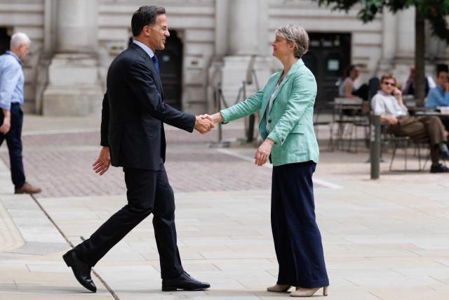 Britain's Foreign Secretary Yvette Cooper (R) and NATO Secretary General Mark Rutte (L) meet in the courtyard of the British Foreign and Commonwealth Office ahead of a meeting in central London on June 29, 2026. (Photo by Dan Kitwood / POOL / AFP)
