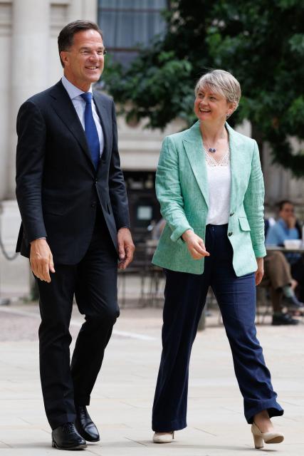 Britain's Foreign Secretary Yvette Cooper (R) and NATO Secretary General Mark Rutte (L) meet in the courtyard of the British Foreign and Commonwealth Office ahead of a meeting in central London on June 29, 2026. (Photo by Dan Kitwood / POOL / AFP)